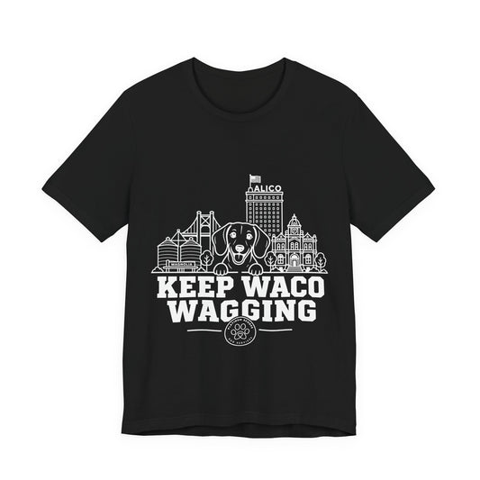 Keep Waco Wagging Dachshund Edition — Dachshund and Waco skyline artwork on Black tee